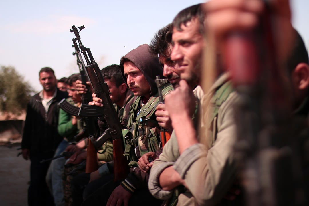 Syrian Democratic Forces(SDF) fighters stand with their weapons north of Raqqa city, Syria on March 8 2017. 